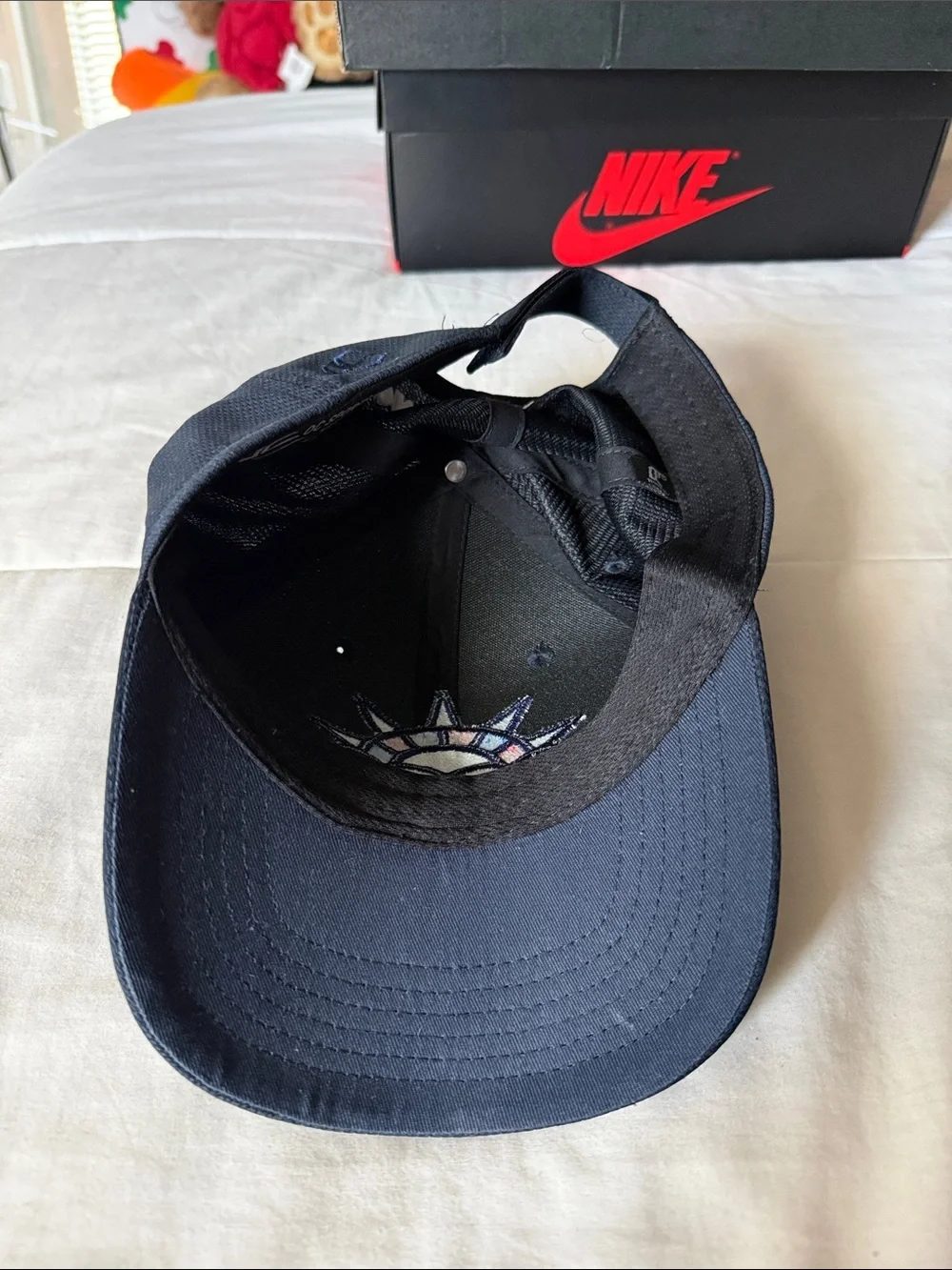 Nike Kids Black Hat with Teal, Purple, Red & White Statue Patch